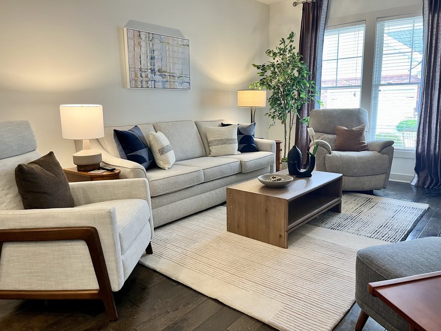 Light-filled living room with a low profile sectional and walnut coffee table